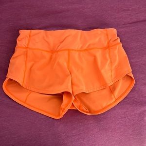 lululemon bright orange speed up shorts size 2!